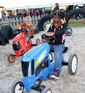 children on toy tractors